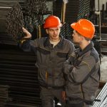 two technicians collaborating to improve production in the steel industry